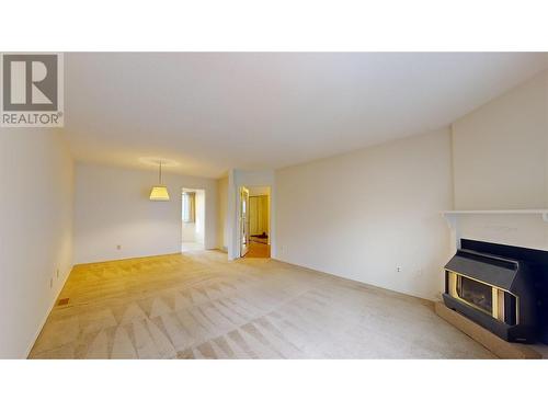 Large open living room - 350 Davie Road Unit# 9, Kelowna, BC - Indoor With Fireplace