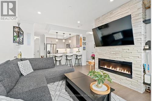 801 - 1880 Gordon Street, Guelph, ON - Indoor Photo Showing Living Room With Fireplace