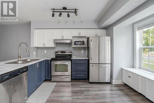 111 - 1491 Maple Avenue, Milton, ON - Indoor Photo Showing Kitchen With Stainless Steel Kitchen With Double Sink