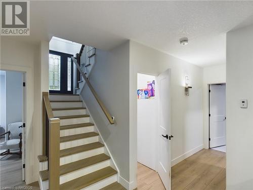 Stairway featuring hardwood / wood-style floors and a textured ceiling - 33 Madwayosh Street, Southampton, ON - Indoor Photo Showing Other Room