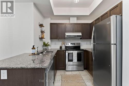 302 - 70 Shipway Avenue, Clarington (Newcastle), ON - Indoor Photo Showing Kitchen With Stainless Steel Kitchen With Double Sink With Upgraded Kitchen