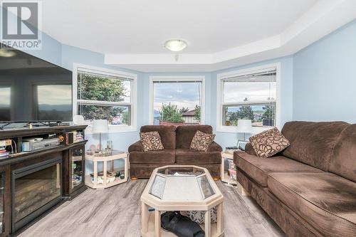 Grd flr suite - 2920 Allenby Way, Vernon, BC - Indoor Photo Showing Living Room With Fireplace