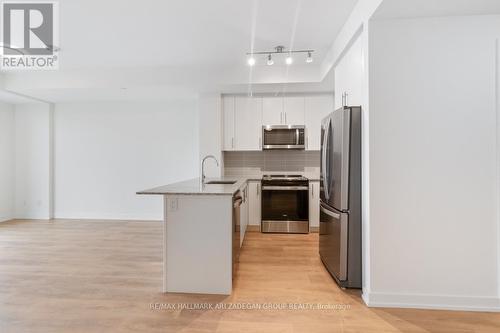 402 - 345 Wheat Boom Drive, Oakville, ON - Indoor Photo Showing Kitchen With Stainless Steel Kitchen