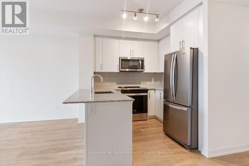 402 - 345 Wheat Boom Drive, Oakville, ON - Indoor Photo Showing Kitchen With Stainless Steel Kitchen With Upgraded Kitchen