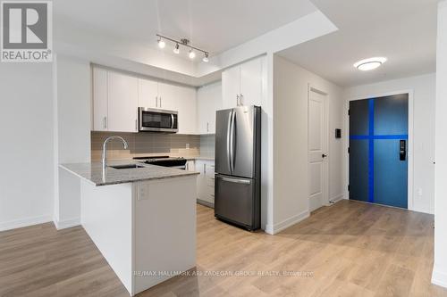 402 - 345 Wheat Boom Drive, Oakville, ON - Indoor Photo Showing Kitchen With Stainless Steel Kitchen