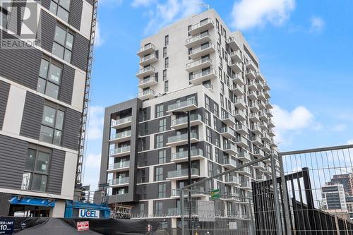 402 - 345 Wheat Boom Drive, Oakville, ON - Outdoor With Balcony With Facade