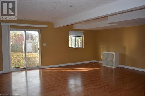 Unfurnished room featuring a textured ceiling and hardwood / wood-style flooring - 147 Weber Street E, Kitchener, ON - Indoor Photo Showing Other Room