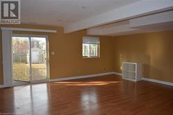 Unfurnished room featuring a textured ceiling and hardwood / wood-style flooring - 