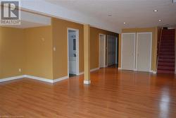 Spare room with a textured ceiling and light hardwood / wood-style flooring - 