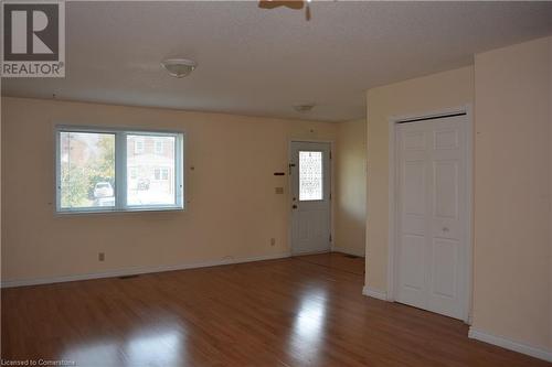 Foyer entrance featuring hardwood / wood-style floors and a textured ceiling - 147 Weber Street E, Kitchener, ON - Indoor Photo Showing Other Room