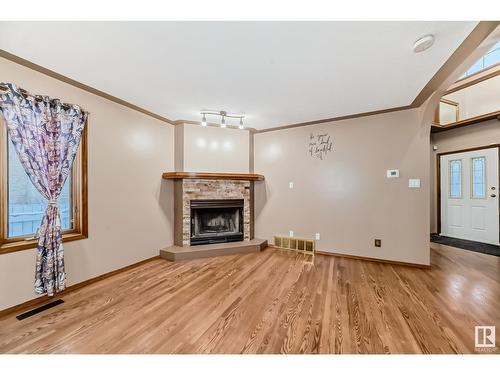 7008 157 Av Nw, Edmonton, AB - Indoor Photo Showing Living Room With Fireplace