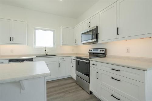 41 Falcon Drive, New Bothwell, MB - Indoor Photo Showing Kitchen With Stainless Steel Kitchen With Upgraded Kitchen