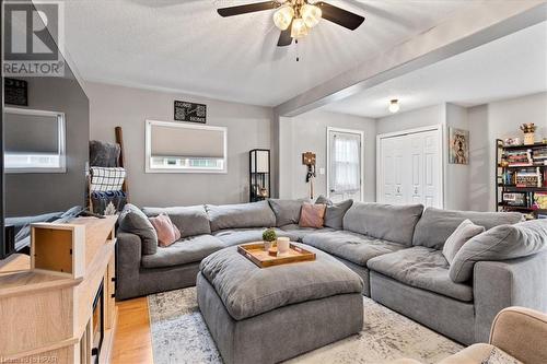 Living room featuring ceiling fan, a textured ceiling, and light hardwood / wood-style flooring - 830 Elma Street W, Listowel, ON - Indoor Photo Showing Living Room