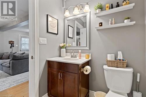 Bathroom featuring wood-type flooring, vanity, and toilet - 830 Elma Street W, Listowel, ON - Indoor Photo Showing Bathroom