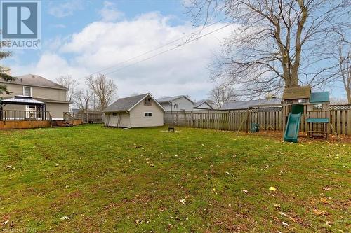 View of yard with a playground, an outdoor structure, and a wooden deck - 830 Elma Street W, Listowel, ON - Outdoor With Backyard