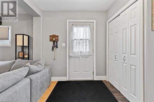 Foyer entrance with wood-type flooring and a textured ceiling - 830 Elma Street W, Listowel, ON - Indoor Photo Showing Other Room