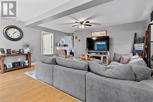 Living room with ceiling fan, a textured ceiling, and hardwood / wood-style flooring - 830 Elma Street W, Listowel, ON - Indoor Photo Showing Living Room