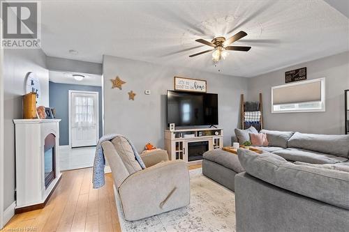 Living room with ceiling fan, a textured ceiling, and light hardwood / wood-style flooring - 830 Elma Street W, Listowel, ON - Indoor Photo Showing Living Room