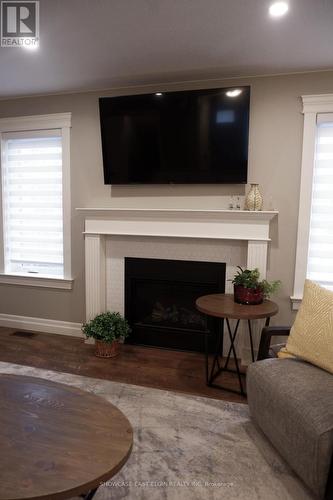 145 Tarry Parkway, Aylmer (Ay), ON - Indoor Photo Showing Living Room With Fireplace