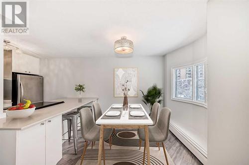 This photo has been virtually staged - 301, 1311 15 Avenue Sw, Calgary, AB - Indoor Photo Showing Dining Room