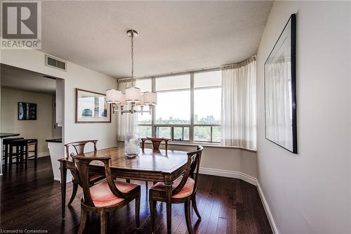 Contemporary Chandelier in Dining Rm - 6 Willow Street Unit# #1505, Waterloo, ON - Indoor Photo Showing Dining Room