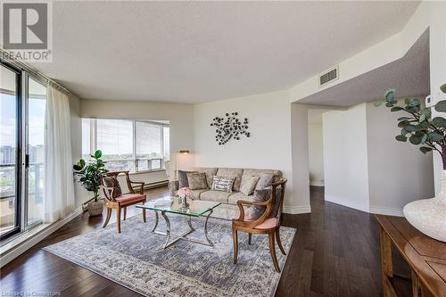 Light Wall Paint & flowing floor plan for flexible designing - 6 Willow Street Unit# #1505, Waterloo, ON - Indoor Photo Showing Living Room