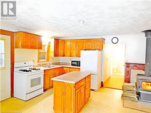 43670 Sider Road, Wainfleet, ON - Indoor Photo Showing Kitchen With Fireplace