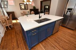 Double sink and an island with breakfast bar. - 