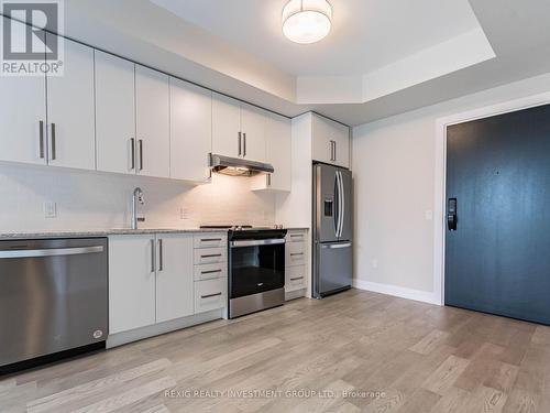 818 - 3220 William Coltson Avenue, Oakville, ON - Indoor Photo Showing Kitchen With Stainless Steel Kitchen