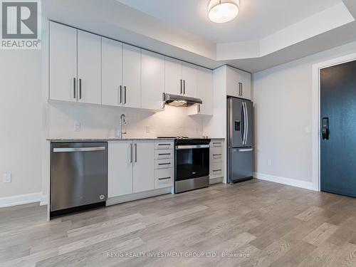 818 - 3220 William Coltson Avenue, Oakville, ON - Indoor Photo Showing Kitchen With Stainless Steel Kitchen