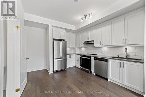 L113 - 9560 Islington Avenue, Vaughan, ON - Indoor Photo Showing Kitchen With Stainless Steel Kitchen With Double Sink