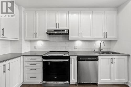 L113 - 9560 Islington Avenue, Vaughan, ON - Indoor Photo Showing Kitchen With Double Sink