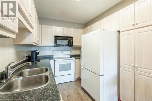 2075 Amherst Heights Drive Unit# 208, Burlington, ON - Indoor Photo Showing Kitchen With Double Sink