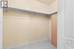 Primary Bedroom Walk In Closet - 