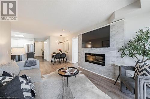 25 Kingsbridge Garden Circle Unit# 1021, Mississauga, ON - Indoor Photo Showing Living Room With Fireplace