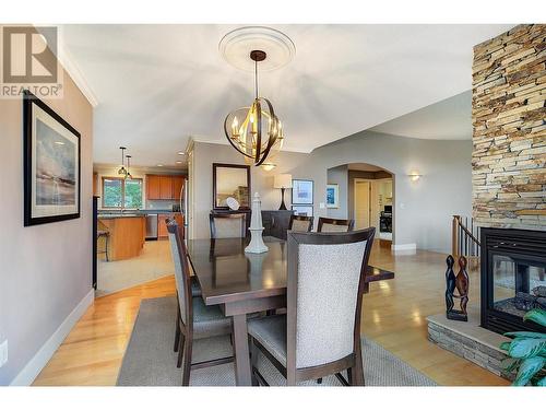 313 Tanager Drive, Kelowna, BC - Indoor Photo Showing Dining Room With Fireplace