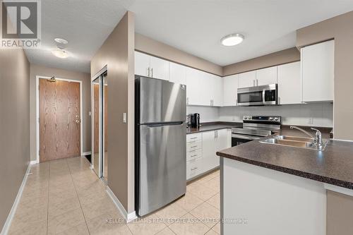 401 - 4879 Kimbermount Avenue, Mississauga (Central Erin Mills), ON - Indoor Photo Showing Kitchen With Stainless Steel Kitchen With Double Sink