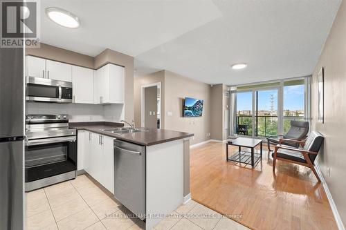 401 - 4879 Kimbermount Avenue, Mississauga, ON - Indoor Photo Showing Kitchen With Stainless Steel Kitchen With Double Sink