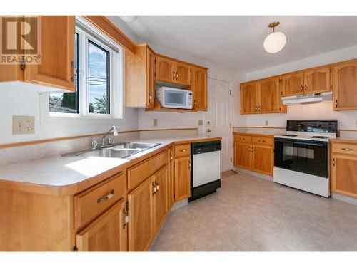 402 Rene Avenue Unit# 101, Penticton, BC - Indoor Photo Showing Kitchen With Double Sink