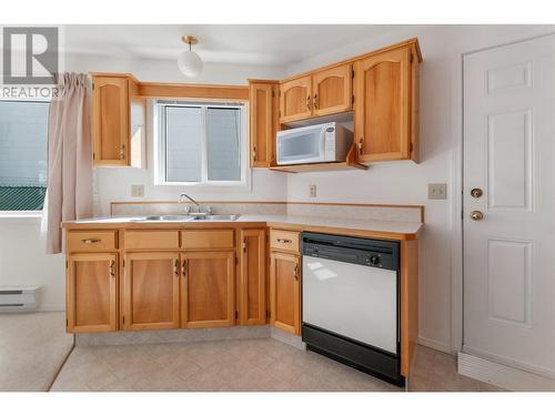 402 Rene Avenue Unit# 101, Penticton, BC - Indoor Photo Showing Kitchen With Double Sink