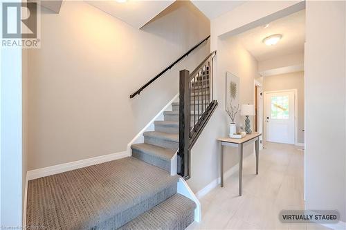 Hallway with access to basement and double car garage - Virtual Staging - 423 Woolwich Street, Waterloo, ON - Indoor Photo Showing Other Room