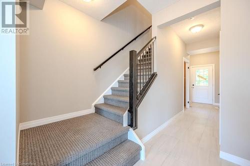 Hallway with access to basement and double car garage - 423 Woolwich Street, Waterloo, ON - Indoor Photo Showing Other Room