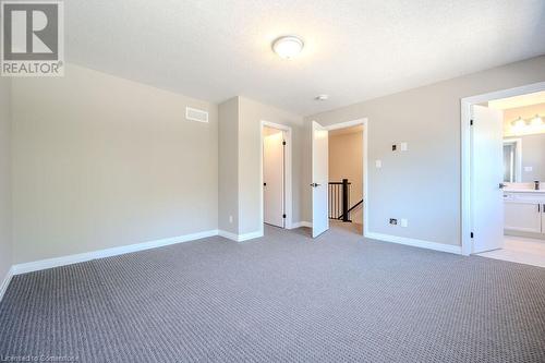 Master Bedroom with Walk In Closet & Ensuite - 423 Woolwich Street, Waterloo, ON - Indoor Photo Showing Other Room