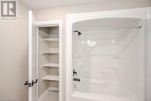 Upstairs Bathroom with storage - 423 Woolwich Street, Waterloo, ON - Indoor Photo Showing Bathroom