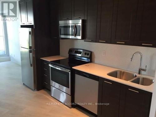 302 - 50 Bruyeres Mews, Toronto (Waterfront Communities), ON - Indoor Photo Showing Kitchen With Double Sink