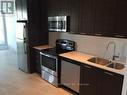 302 - 50 Bruyeres Mews, Toronto (Waterfront Communities), ON  - Indoor Photo Showing Kitchen With Double Sink 