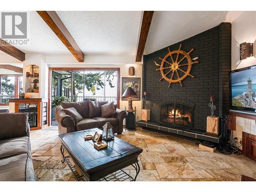 240 Clifton Road N, Kelowna, BC - Indoor Photo Showing Living Room With Fireplace