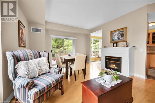 2000 Creekside Drive Unit# 305, Dundas, ON - Indoor Photo Showing Living Room With Fireplace