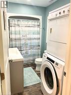 Brand new bathroom with laundry. - 