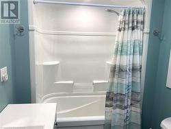 Shiny new tub/shower with light. - 